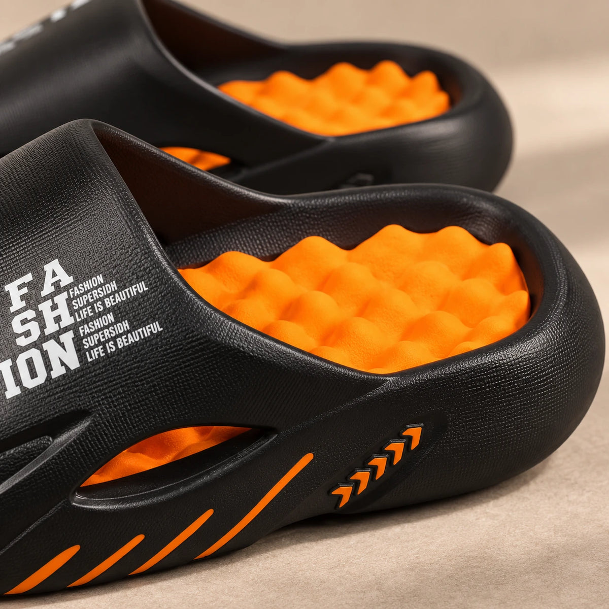 Close-up of the orange massage footbed and moulded black rim