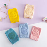 Five colours of smiley baby crawling knee pads