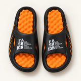 Overhead view of the orange textured footbeds and open-toe design